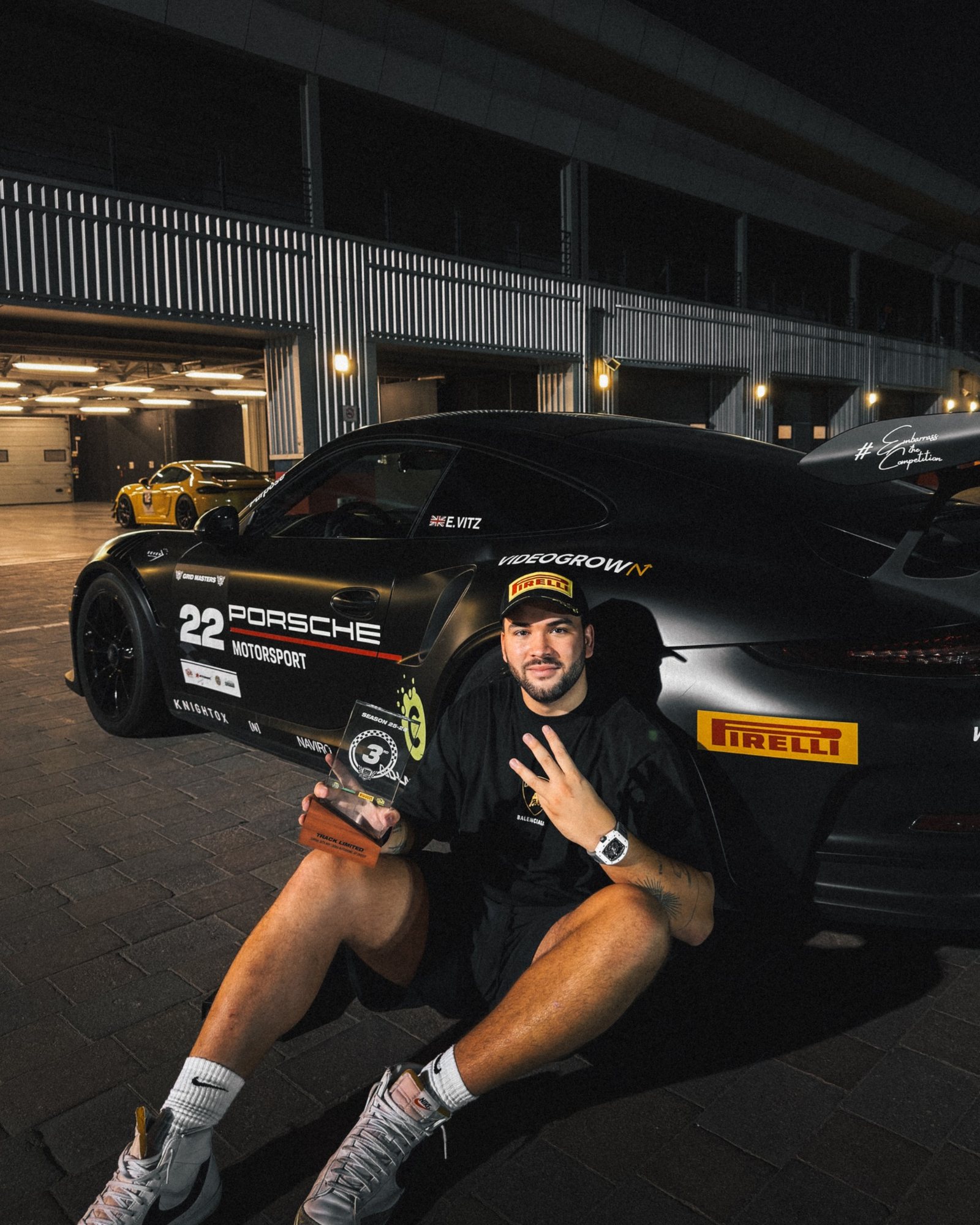 Elliott with the trophy against the car